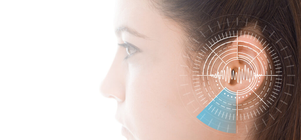 Woman undergoes a hearing test to verify her hearing skills.