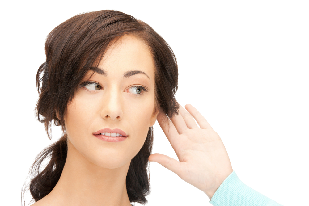 Does Hearing Loss Always Affect Both Ears Equally? 1 Woman holds a hand to one ear to hear better.